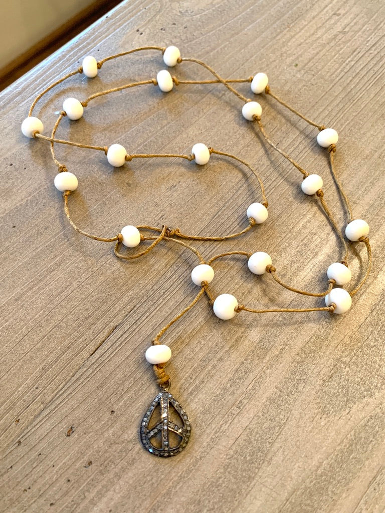 Bone Beaded and Hand Knotted Lariat Style Necklace with Pave Diamond Peace Pendant