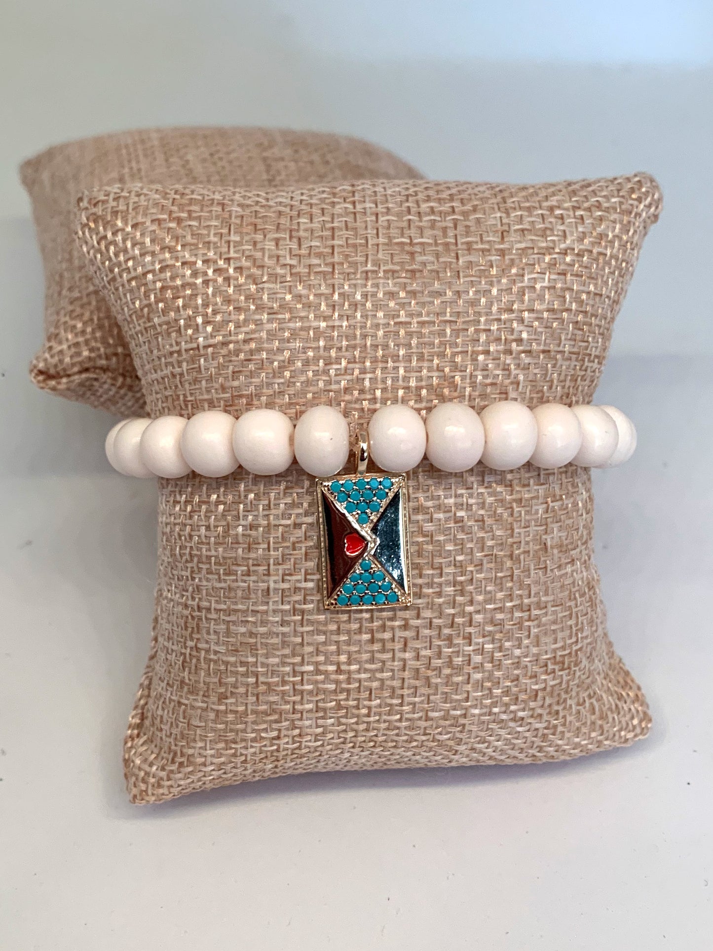 Cream Bone Beaded Bracelet with Sealed with a Heart Kiss Charm