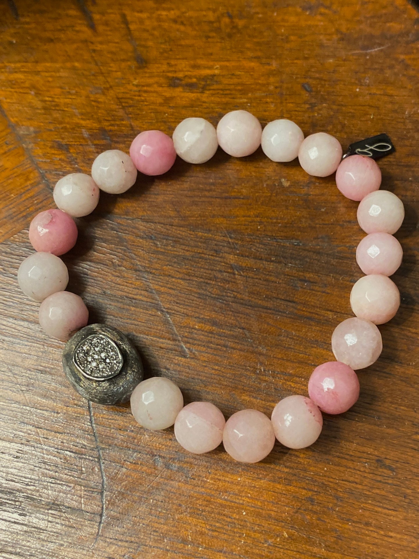 Pink jade bracelet with oxidized diamond center stone