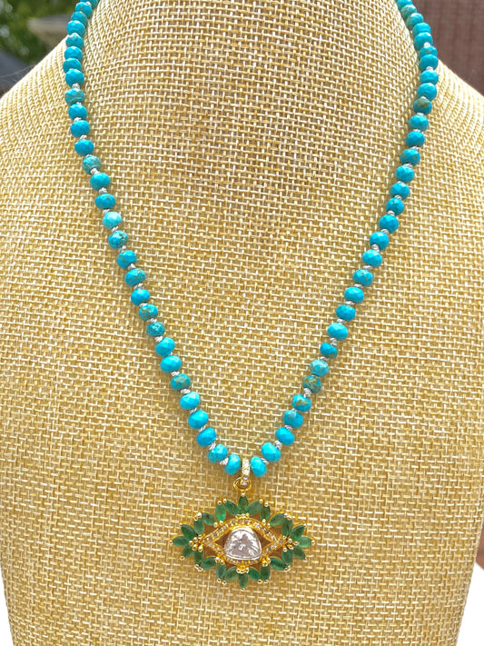 Emerald and Diamond Evil Eye Pendant on Turquoise Hand Knotted Silk